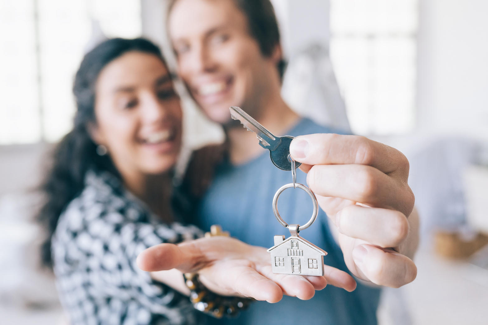 Happy homeowners with keys